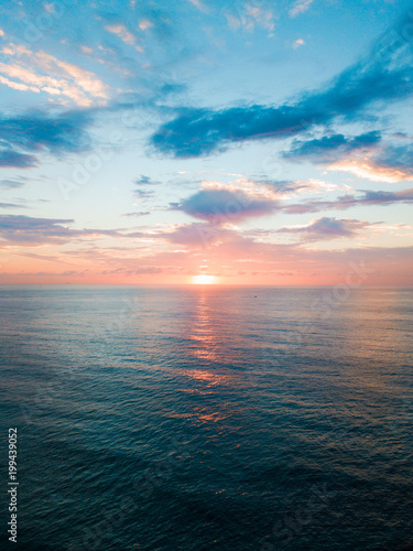 Cloudy sunrise view over the water.