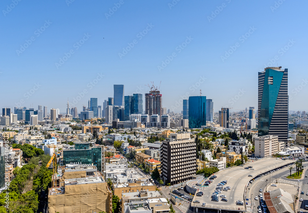 Rooftop view of Tel Aviv center. Old houses and modern skyscrapers.