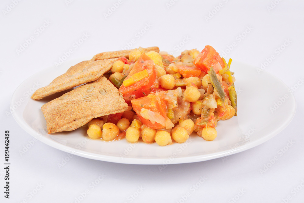 Baked vegetables and cheese biscuits on a white Baked vegetables and cheese biscuits on a white