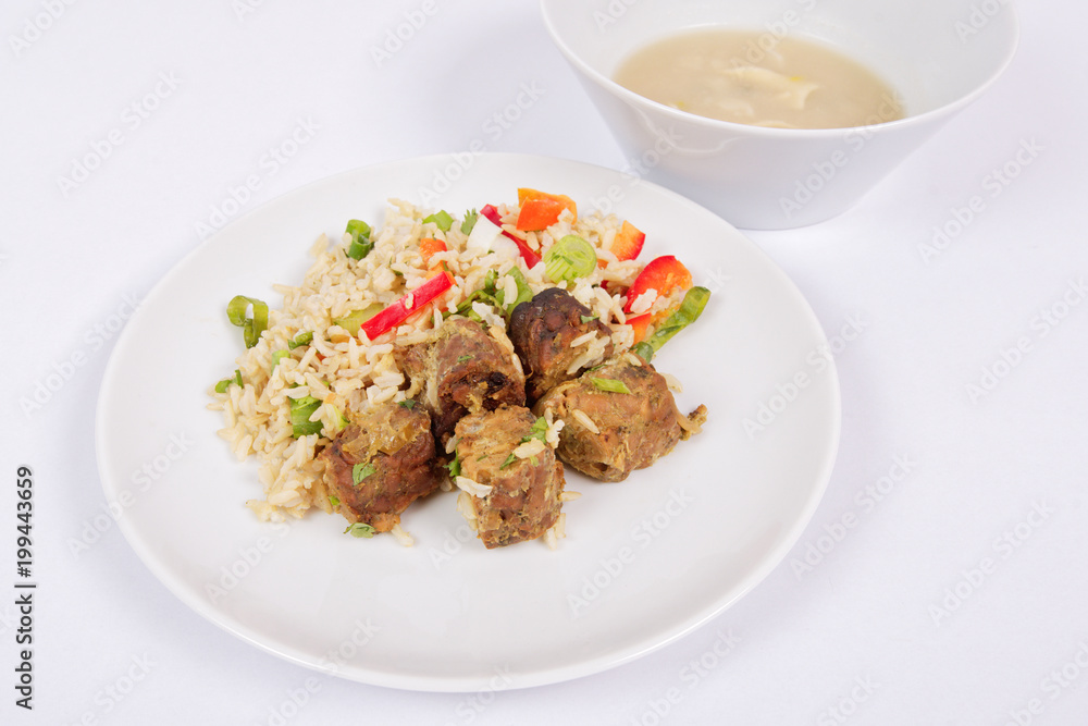 Thai tempeh with coriander and rice on a white