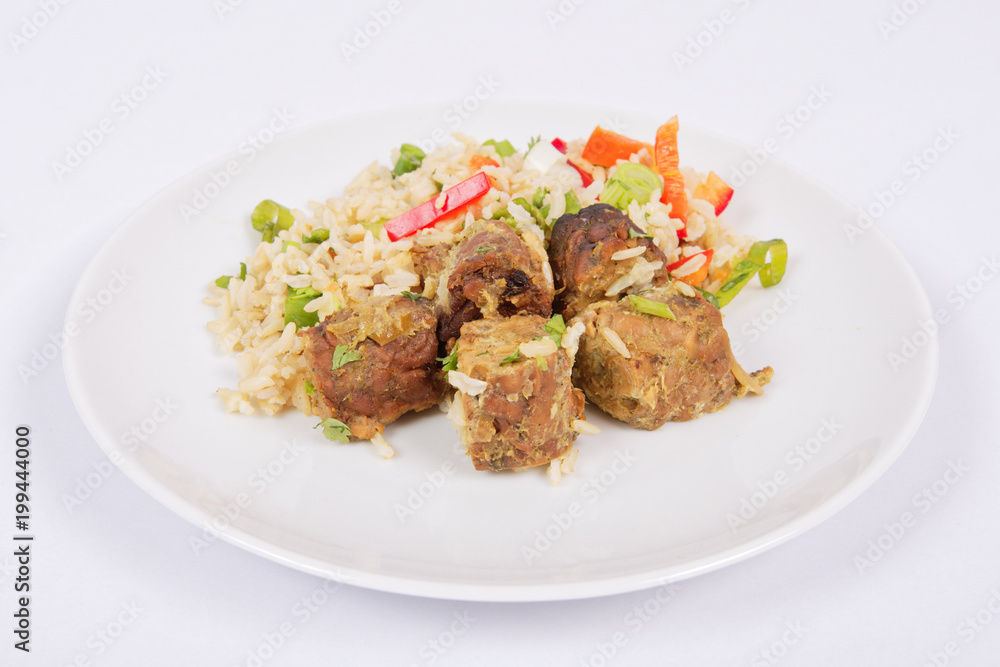 Thai tempeh with coriander and rice on a white Thai tempeh with coriander and rice on a white