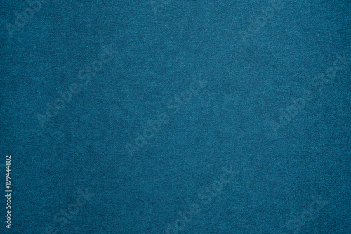 Textured blue artistic grainy background for use in screensavers, wallpapers, for inscriptions and drawings.