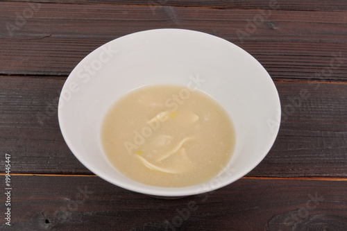 Cauliflower soup with noodles on a table