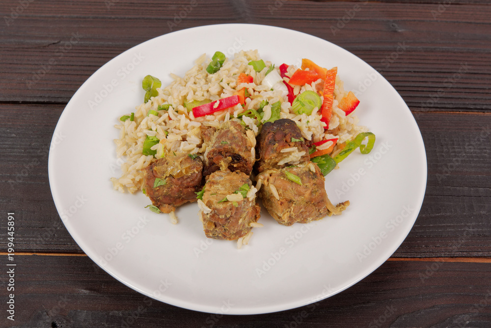 Thai tempeh with coriander and rice on a table