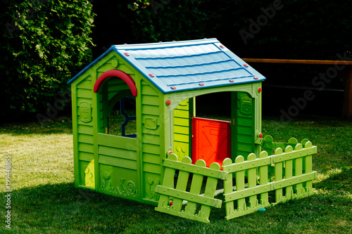 children's plastic house on the lawn