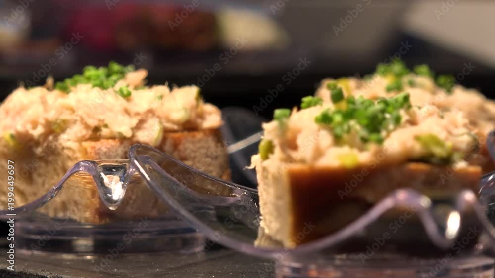 Bread with gourmet paste and herbs on a table - closeup Bread with gourmet paste and herbs on a table - closeup