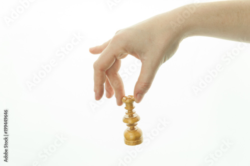 female hand taking chess piece on white background