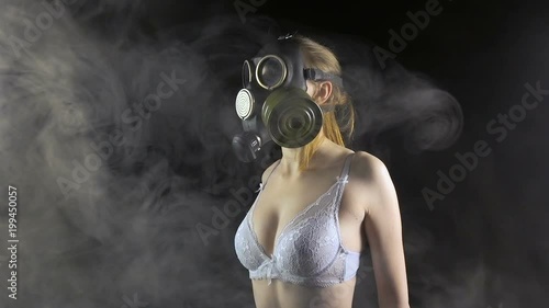 Girl in gas mask wearing white lingerie