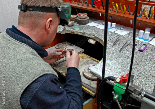 Manufacture of jewelry. Repair rings. Jeweler at work.