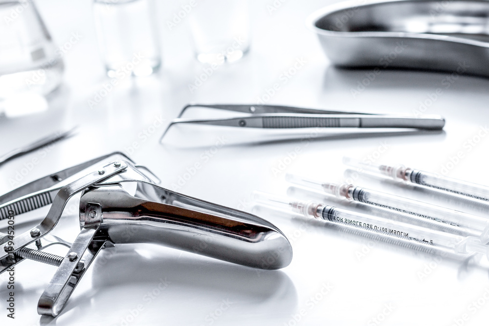 instruments of gynecologist on white background instruments of gynecologist on white background
