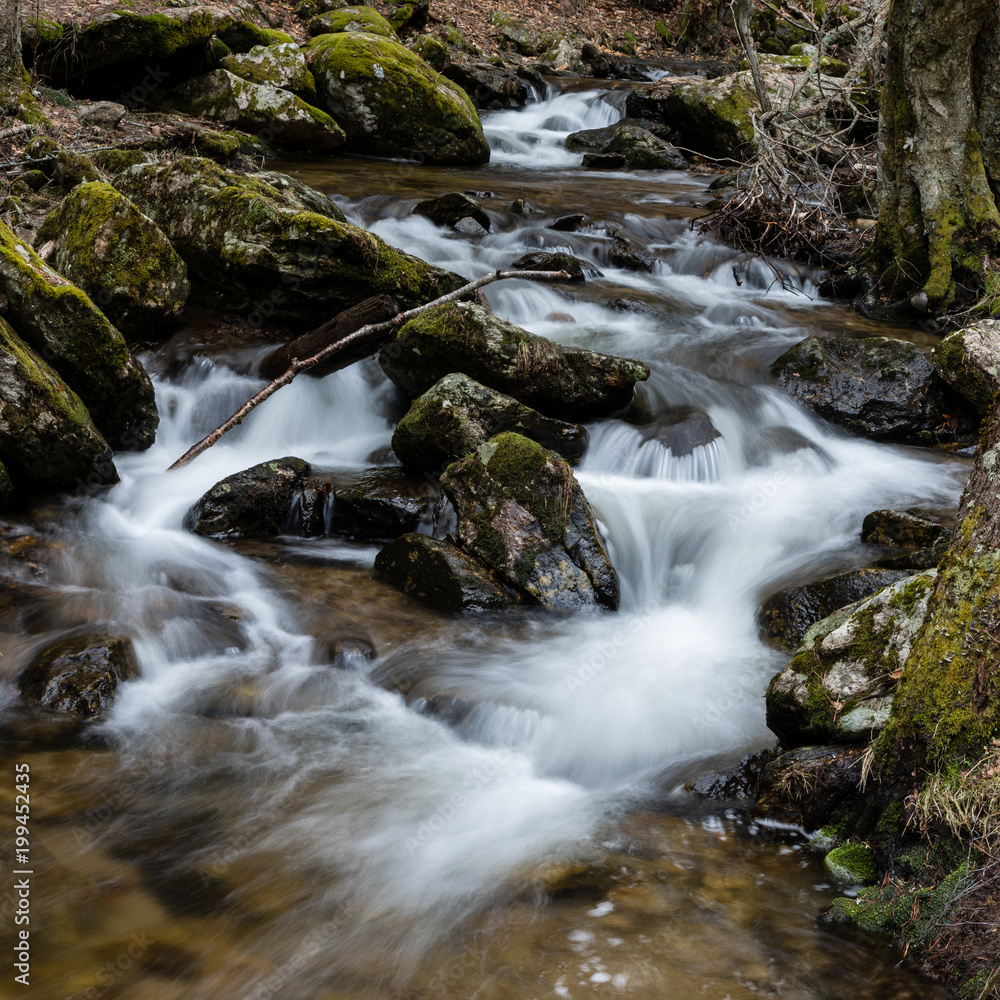 Waterfall from snow melt in the mountains of Madrid, Spain