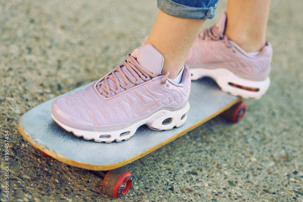 foots on skateboard