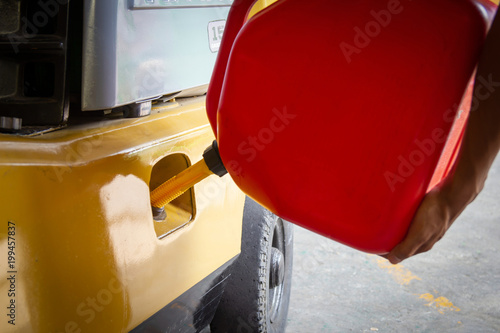 Refueling Using a gallon tank for a forklift or machine..Used in industrial plants.