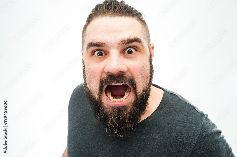 Closeup portrait of angry, mad, annoyed, skeptical, grumpy man, employee, worker isolated on white background. Human emotions, face expressions, reaction, interpersonal conflict resolution Closeup portrait of angry, mad, annoyed, skeptical, grumpy man, employee, worker isolated on white background. Human emotions, face expressions, reaction, interpersonal conflict resolution