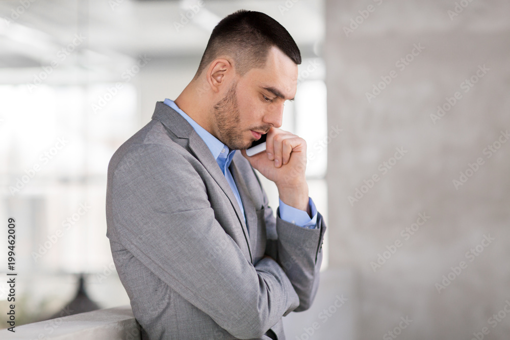 business people, technology and corporate concept - businessman calling on smartphone at office business people, technology and corporate concept - businessman calling on smartphone at office