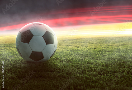 Fußball vor deutschlandfarbenden Lichteffekten