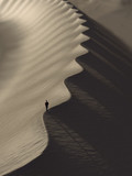 man walking in the desert