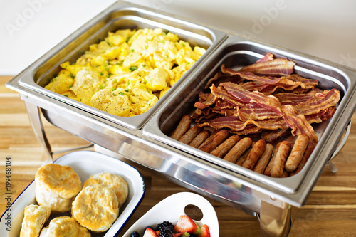 Fototapeta Breakfast buffet with scrambled eggs and bacon