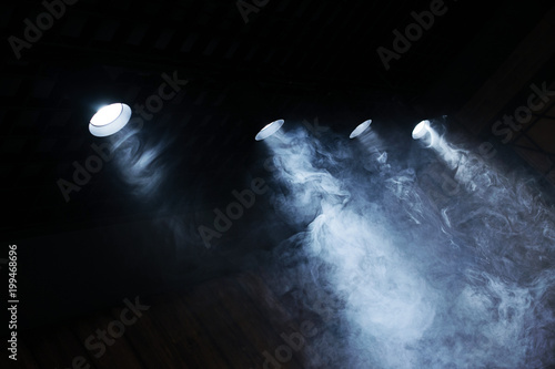 Lamps of light with a cloud of smoke. Close-up.