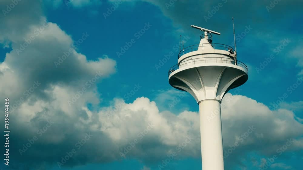 Rotating antenna of the radar on background of blue sky with clouds. Rotating antenna of the radar on background of blue sky with clouds.