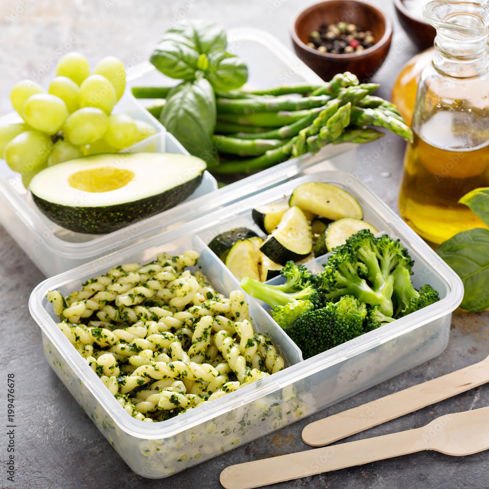 Vegan meal prep containers with pasta and vegetables Vegan meal prep containers with pasta and vegetables