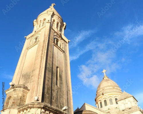 The two spires of the Sacred Heart Basilica in Balata (Martinique) against blue sky