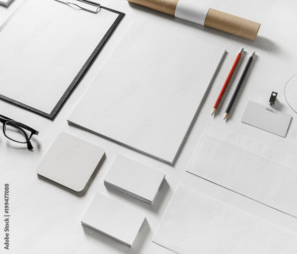 Photo of blank stationery set on paper background. Photo of blank stationery set on paper background.