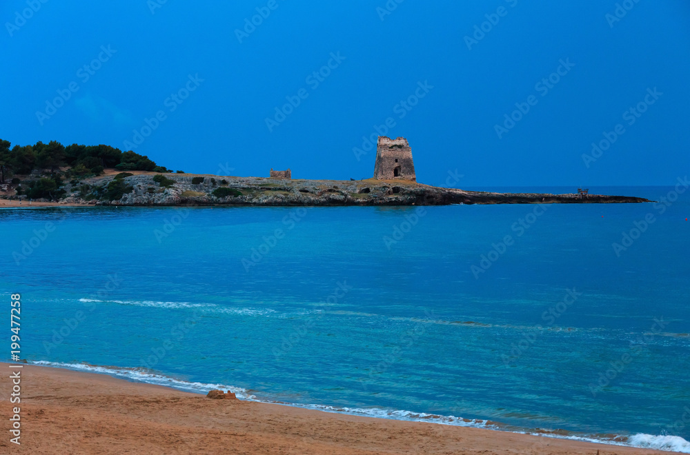 Early morning torre on Sfinale beach (Gargano peninsula in Puglia, Italy)
