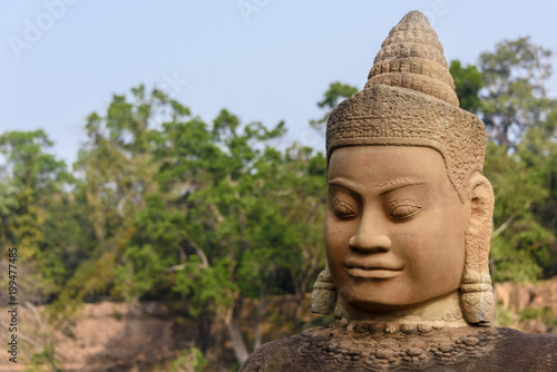 Statues line the entrance to the Unesco World Heritage site of Ankor Thom, Siem Reap, Cambodia photo