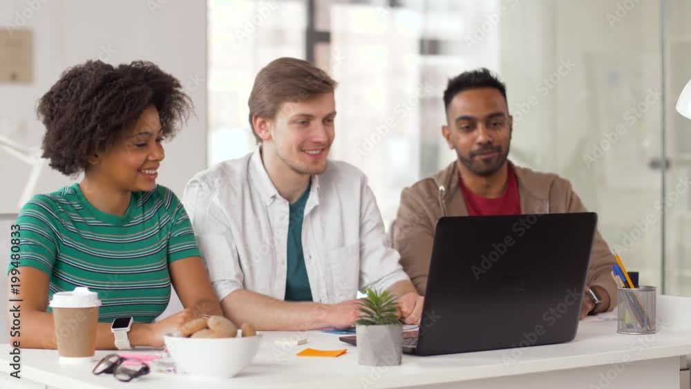 business, online communication and technology concept - happy creative team having video conference or interview at office and waving hands business, online communication and technology concept - happy creative team having video conference or interview at office and waving hands