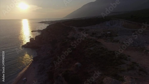 Sunset at beach near the mountains in Albania photo