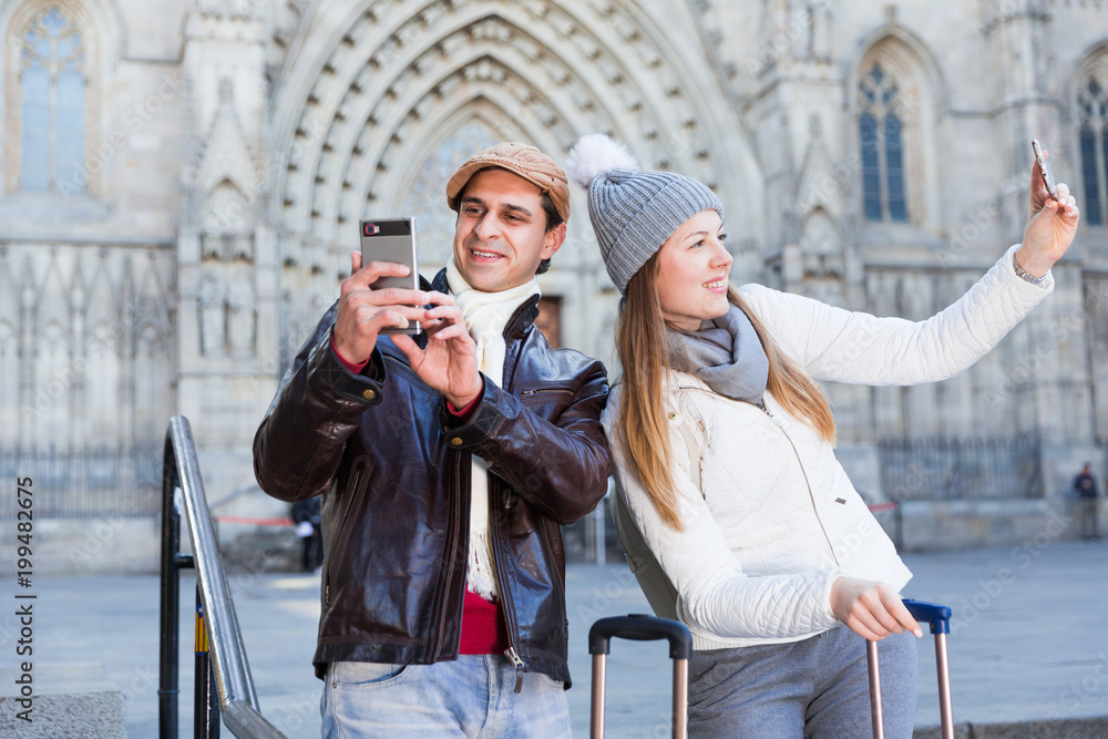 Smiling couple man and woman taking selfie