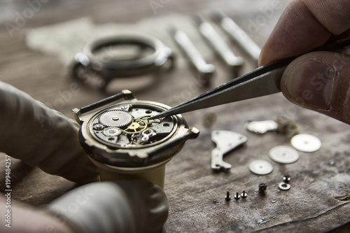 Process of installing a part on a mechanical watch, watch repair photo