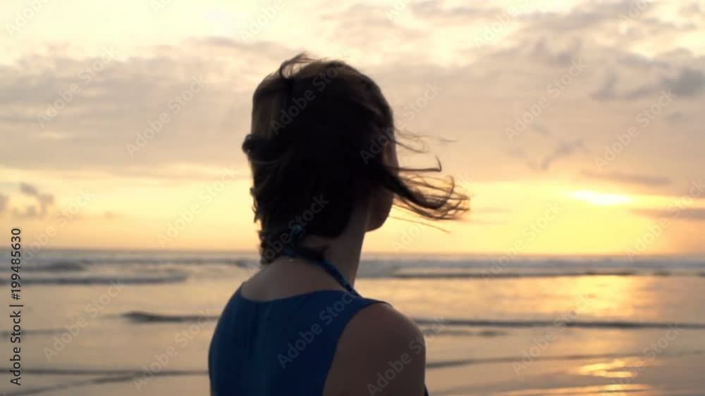 Pensive beautiful woman admire sunset on beach
Pensive beautiful woman admire sunset on beach