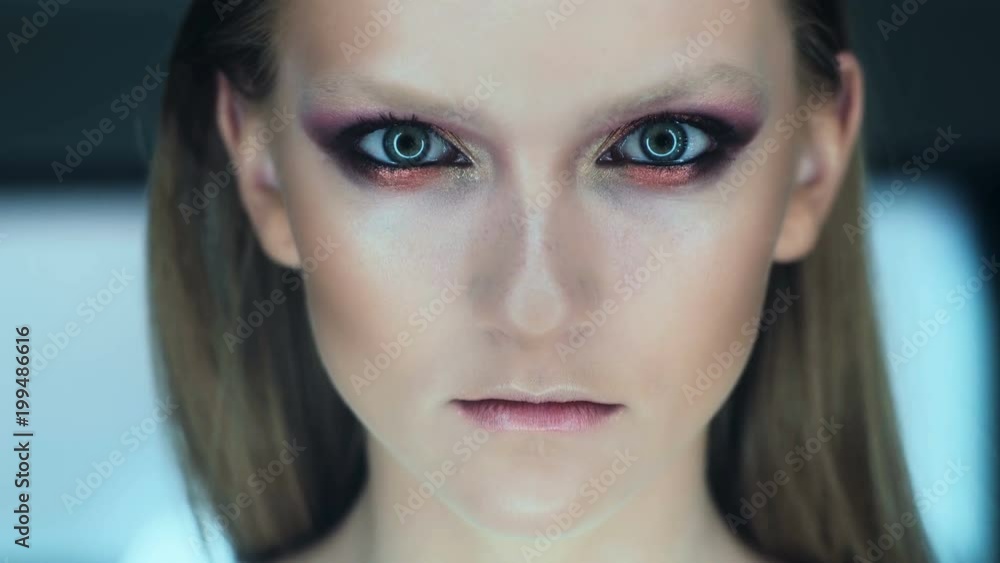 Makeup artist apply makeup to an attractive young woman. Makeup for young girl. Young girl in beauty salon. Makeup artist apply makeup to an attractive young woman. Makeup for young girl. Young girl in beauty salon.