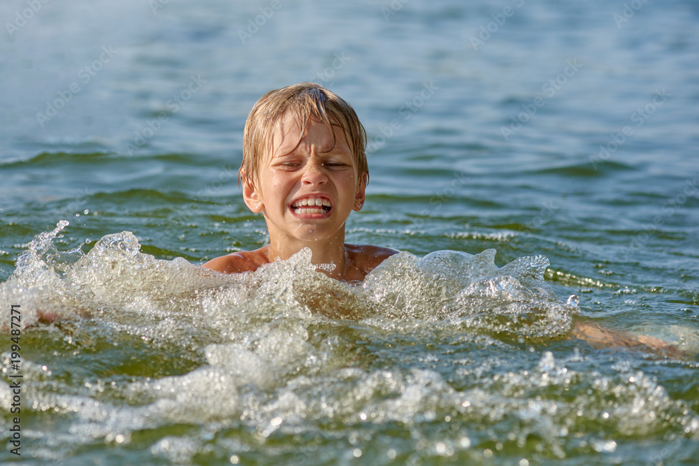 little Boy swimming in the river little Boy swimming in the river