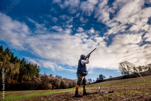 Gun shooting on a pheasant shoot photo