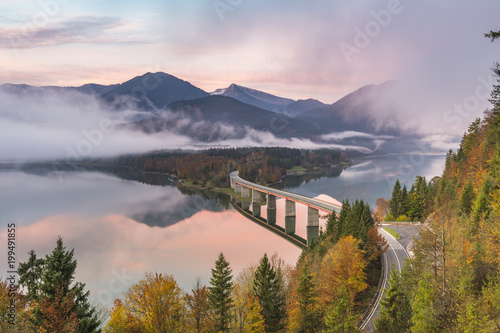 Sylvenstein Lake and bridge surrounded by the morning mist at dawn, Bad Tolz-Wolfratshausen district, Bavaria, Germany photo