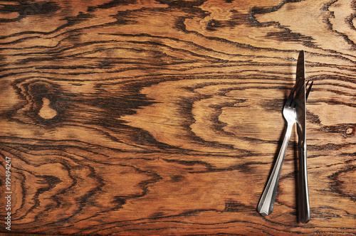 Fényképezés Knife with fork on the wooden background