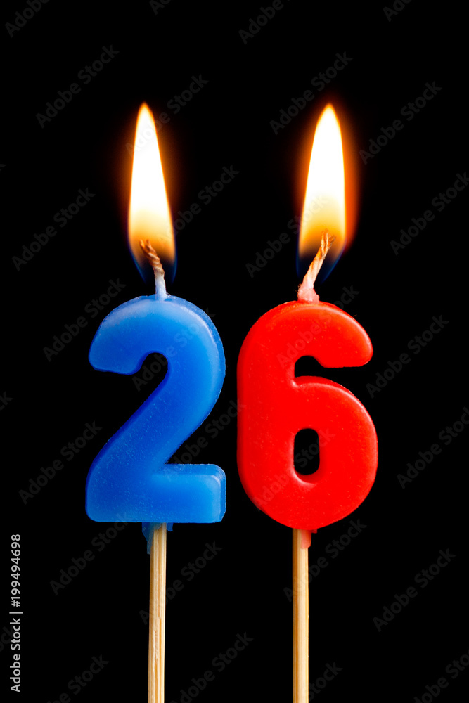 Burning candles in the form of 26 twenty six (numbers, dates) for cake isolated on black background. The concept of celebrating a birthday, anniversary, important date, holiday, table setting Burning candles in the form of 26 twenty six (numbers, dates) for cake isolated on black background. The concept of celebrating a birthday, anniversary, important date, holiday, table setting