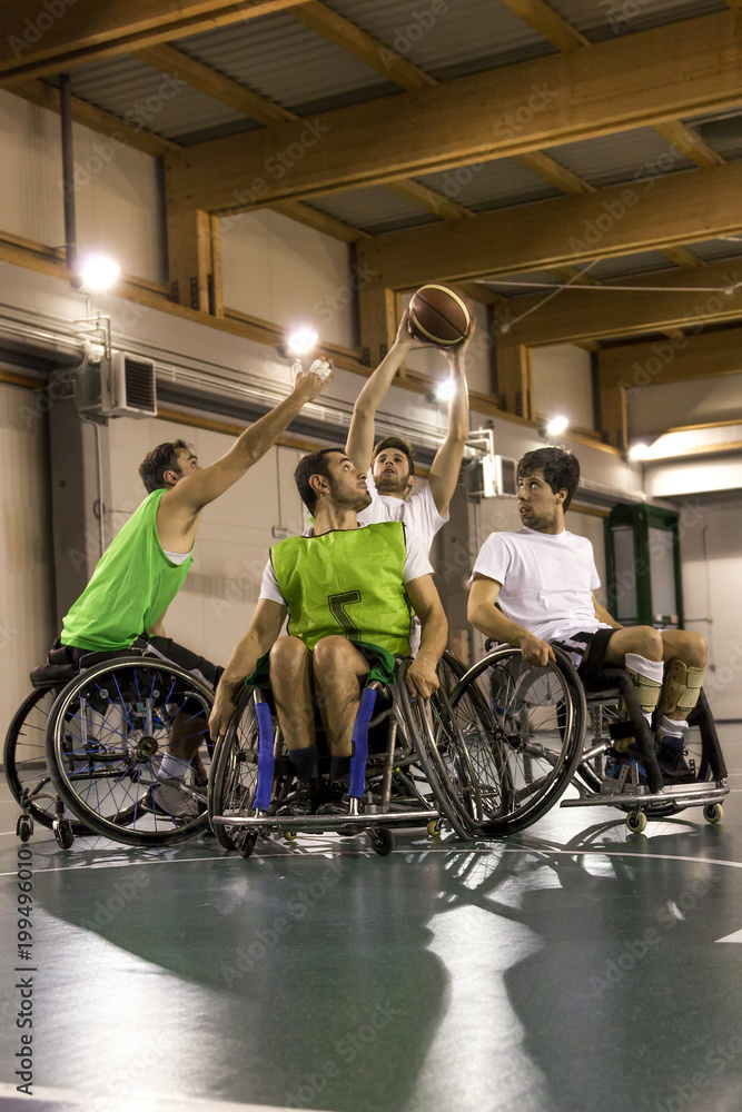 disabled sport men in action while playing basketball disabled sport men in action while playing basketball
