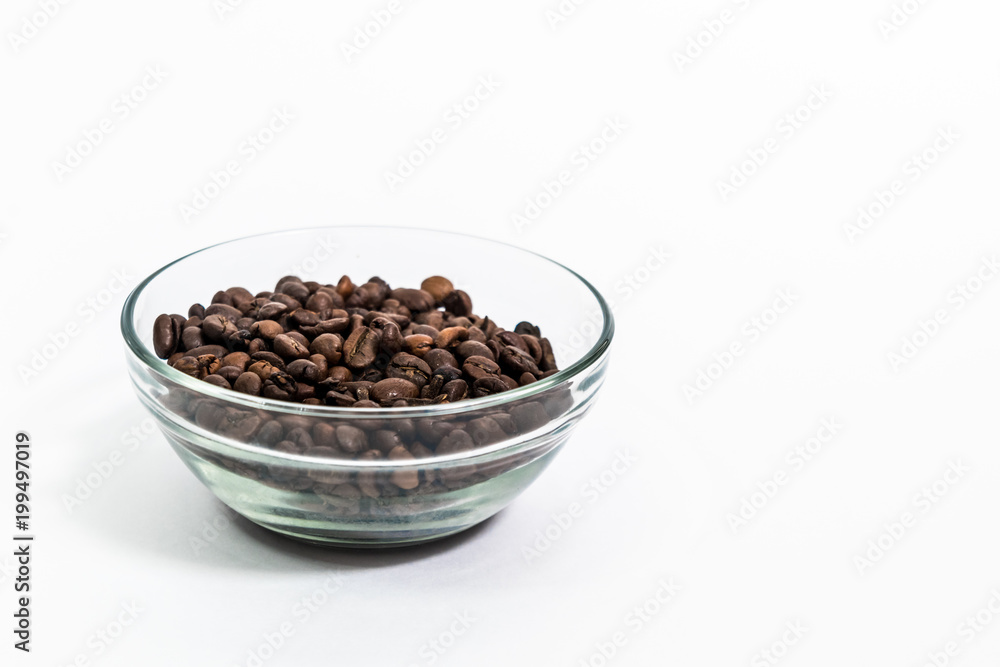 coffee beans in a transparent cup on a white background