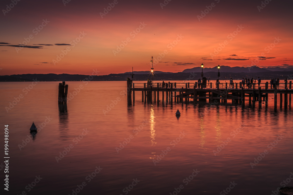 View of golden sunset on Lake Garda, Sirmione, Lake Garda, Lombardy, Italian Lakes View of golden sunset on Lake Garda, Sirmione, Lake Garda, Lombardy, Italian Lakes