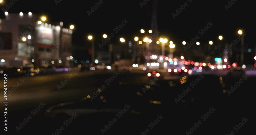 City at night background with moving cars. Out of focus background with blurry unfocused city lights. City at night background with moving cars. Out of focus background with blurry unfocused city lights.