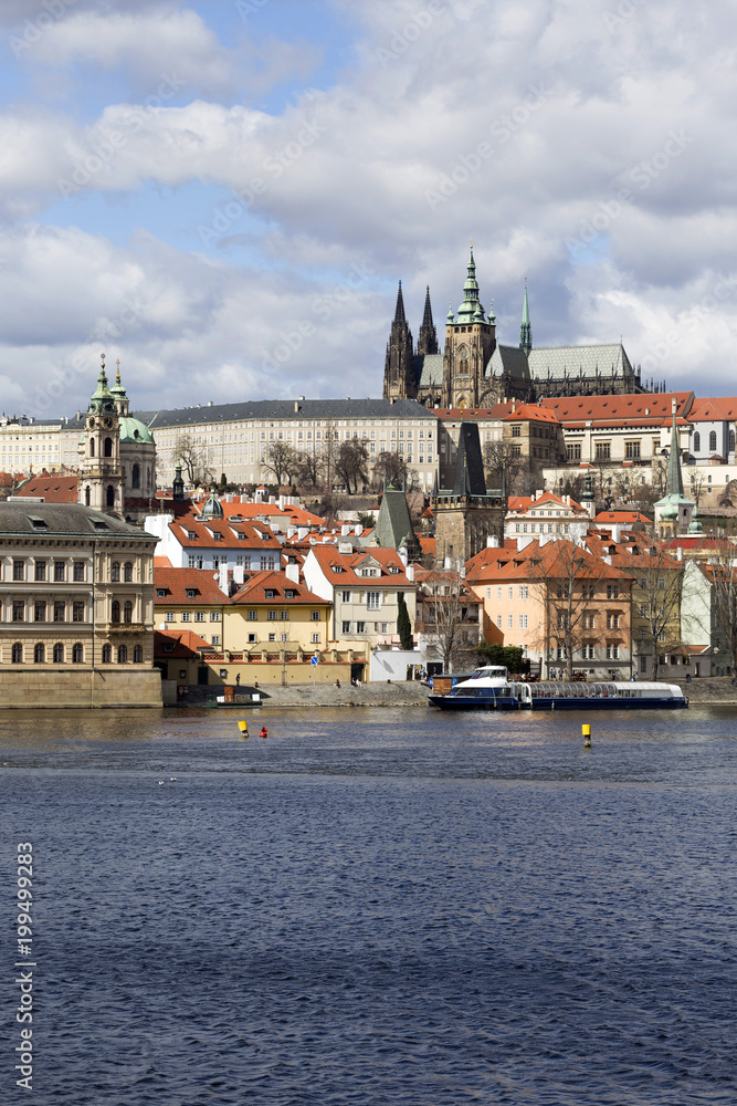 Early Spring Prague gothic Castle with the Lesser Town above River Vltava in the sunny Day, Czech Republic