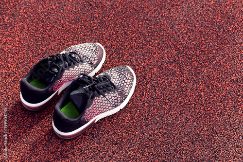 Close-up, top view running shoes for wommen isolated on a racetrack photo