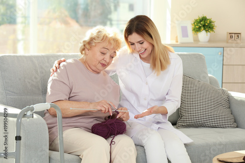 Senior woman sitting on sof...