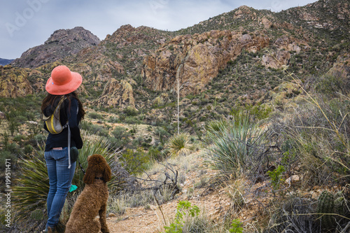 Hispanic woman hiking on a mountain trail near Tucson, Arizona.