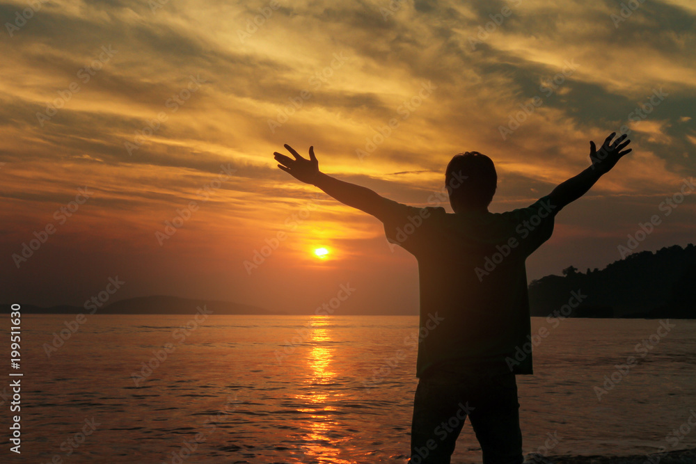 Silhouette business people victory raising hands  with sunset sky. Motivation and success concept.