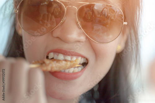 hungry young woman eating roast pork.selective focus. photo